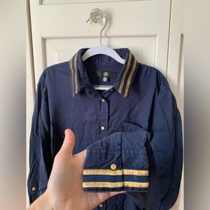Navy button up with gold embroidered stripes on collar and cuffs